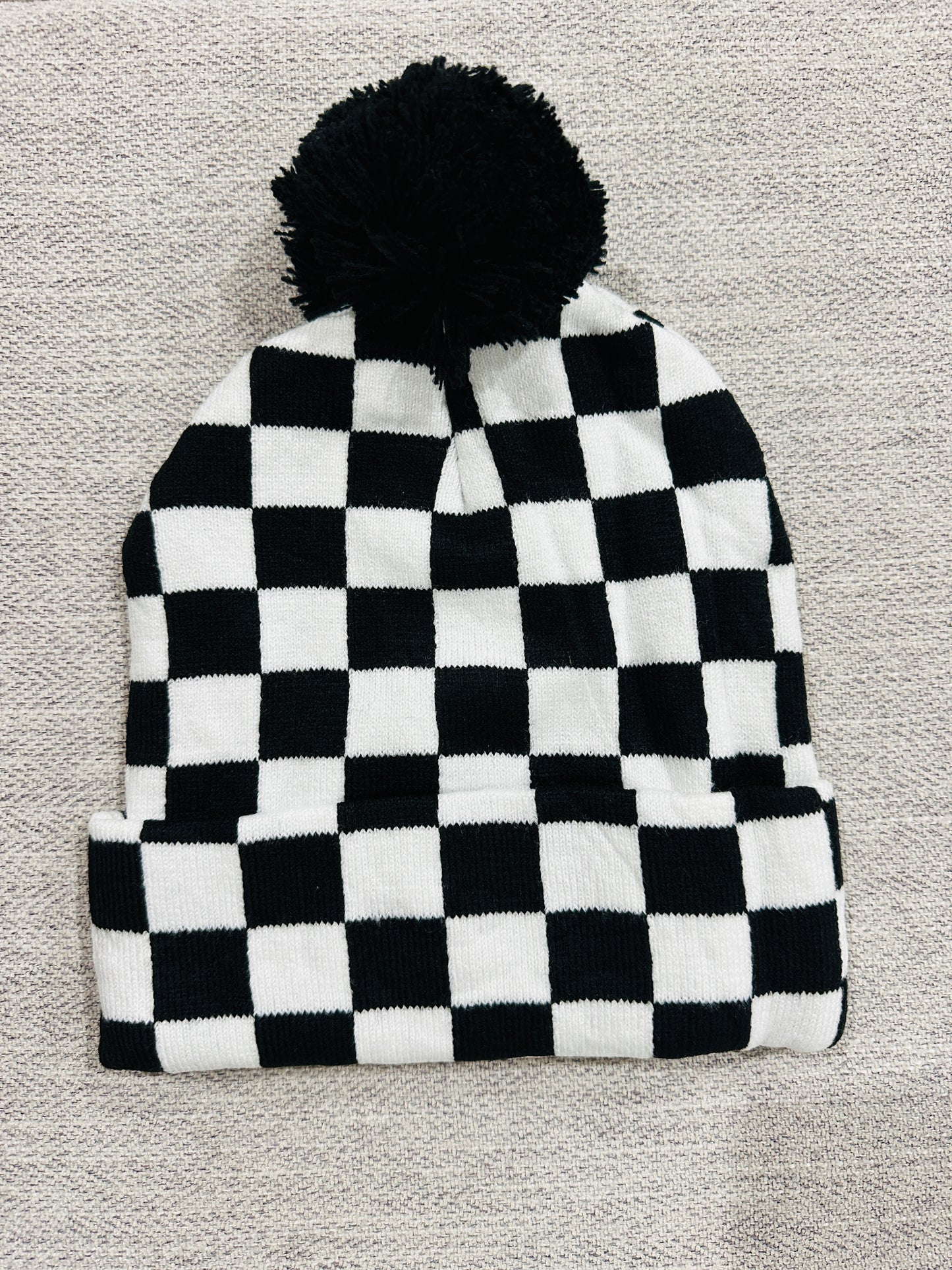 Black & white checkered pom beanie